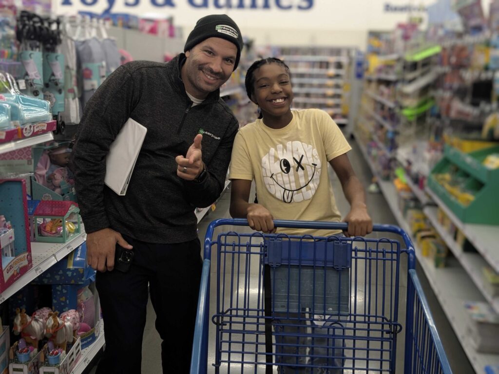 Volunteers and scholars at DREAM Christmas shopping